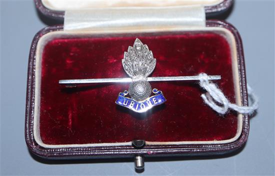 A yellow metal, enamel and diamond chip set Royal Artillery sweethearts brooch, 45mm.